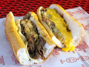 Philly Cheesesteak sandwiches from Pat's. One with provolone, one with cheez whiz.