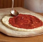 pizza sauce on dough